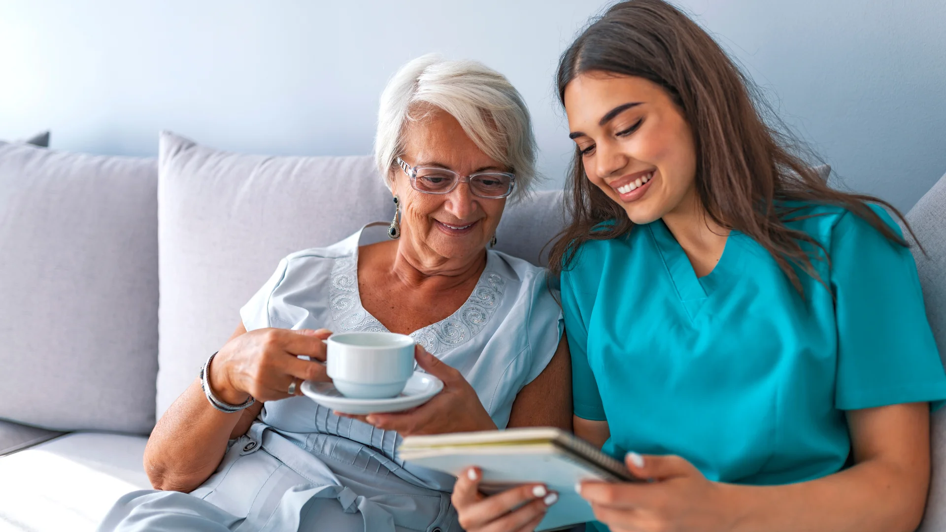 Night care in Clare: carer bringing a warm drink to an older man before bed